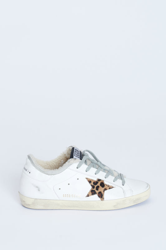 Natural shearling lined distressed white Superstar trainers with Leopard print pony skin star appliqué