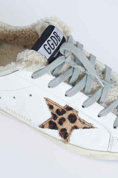Natural shearling lined distressed white Superstar trainers with Leopard print pony skin star appliqué