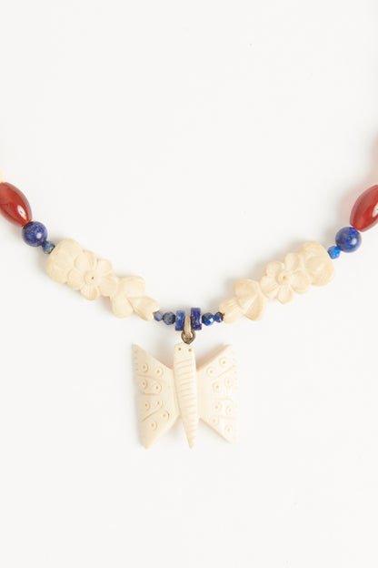 Red carnelian and blue lapis
beads with Antique bone
butterfly and antique floral
carved beads Necklace