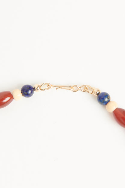 Red carnelian and blue lapis
beads with Antique bone
butterfly and antique floral
carved beads Necklace