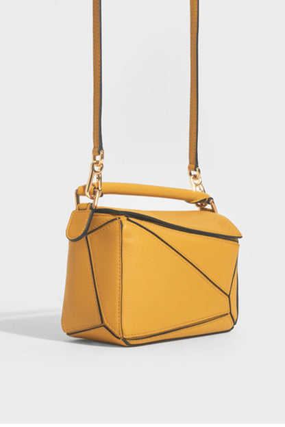 Puzzle Mini Leather Shoulder Bag in Mustard