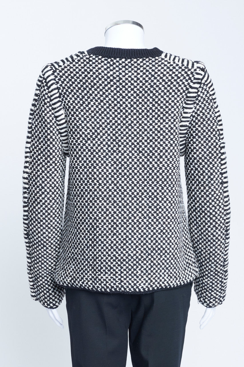 Nicolas Ghesquiere era black and white chunky wool herringbone knit with structured shoulder details.